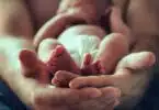 baby being held by dad
