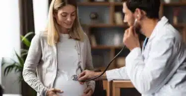 pregnant woman is being check out by her doctor