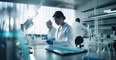 laboratory with scientists in lab coats conducting experiments