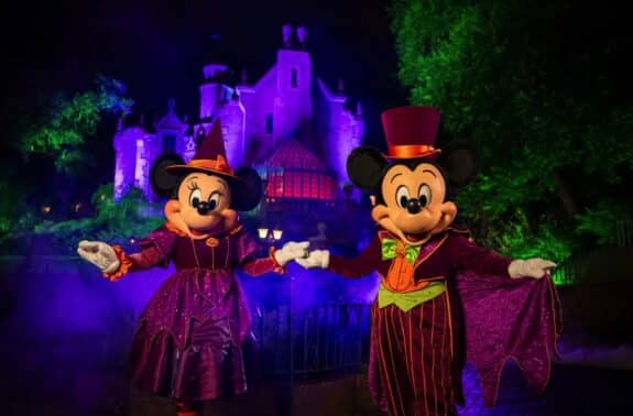 Mickey and Minnie outside of the haunted mansion