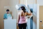 A woman patient having mammography examination at hospital.