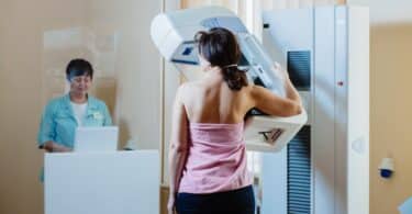 A woman patient having mammography examination at hospital.