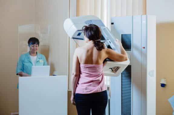  A woman patient having mammography examination at hospital. 