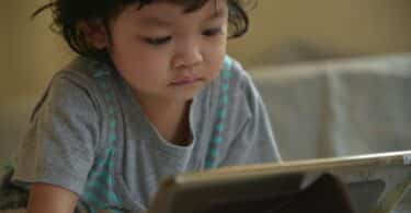 toddler in front of ipad