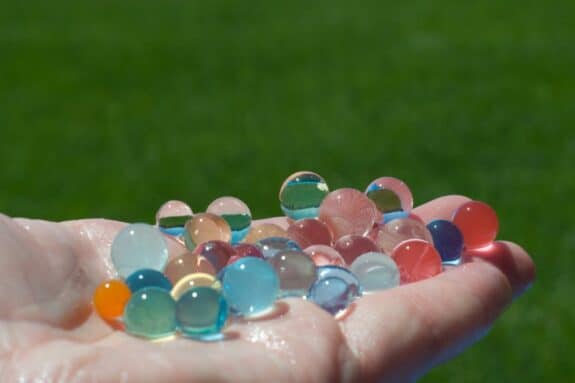 water beads in the palm of a hand