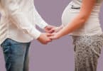 Parents are pregnant while waiting for the child to be hold hands