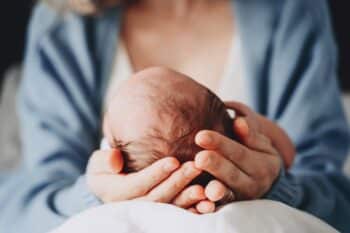 mom holding newborn baby