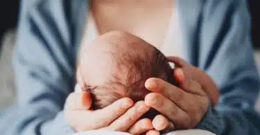 mom holding newborn baby