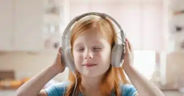 child listening to music