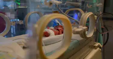 premature baby in isolette