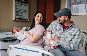 Kelsey holds Roxi while her husband, Caleb, holds Rebel.