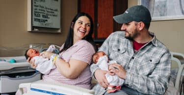 Kelsey holds Roxi while her husband, Caleb, holds Rebel.