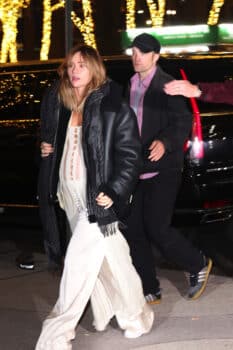 Pregnant Suki Waterhouse and Robert Pattinson leave the DGA theater to attend the Poor Things movie premiere after party