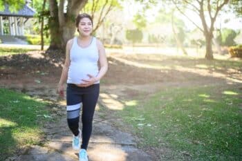 pregnant woman walking and workout in the park