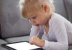 toddler playing with their iPad