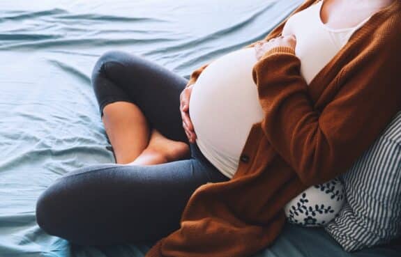 pregnant woman on the couch.