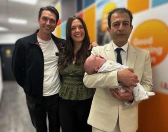 Hooman Soleymani Majd holds baby Rafferty Isaac with parents Lucy and Adam