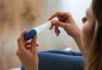 Young woman looking at pregnancy test