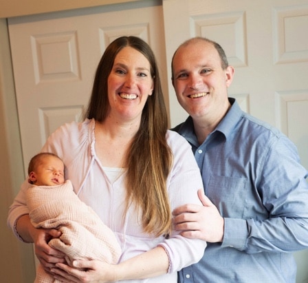 Kirsten Adams and her husband Trent with their Rainbow baby Kayleigh