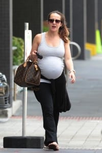 A very pregnant Ashley Hebert arrives in Miami