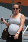 A very pregnant Ashley Hebert arrives in Miami, FL