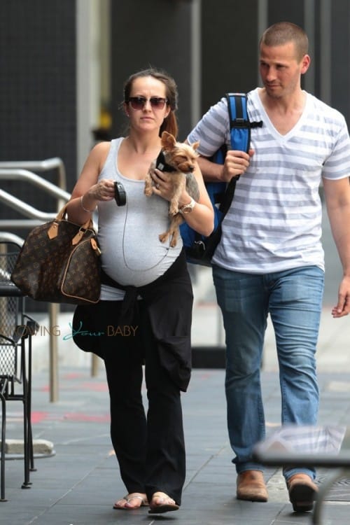 A very pregnant Ashley Hebert with husband J.P Rosenbaum