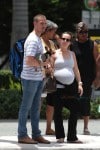 A very pregnant Ashley Hebert with husband J