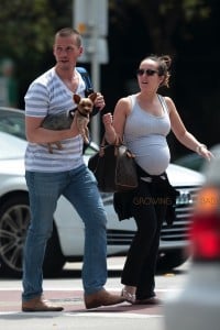 A very pregnant Ashley Hebert with husband J