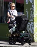 True Blood star Anna Paquin walks up and down Abbot Kinney with one of her babiess in a chest harness and the other in the stroller in Venice Beach