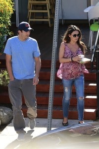 Ashton Kutcher with a pregnant Mila Kunis