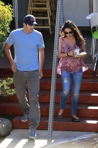 Ashton Kutcher with a pregnant Mila Kunis