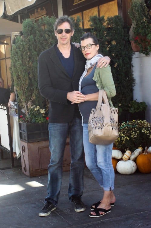 Milla Jovovich showing off a large baby bump in a tight tank top as she and her husband Paul W.S. Anderson walk back to their car after having lunch at La Scala in Beverly Hills