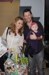 Beverly Mitchell and husband Mark Cameron with daughter Kenzie at Santas Secret Workshop