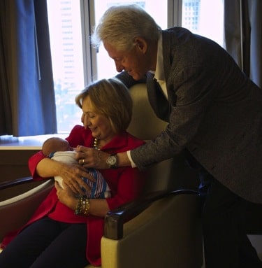 Bill and Hilary Clinton with granddaughter Charlotte