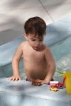 Brooks Stuber plays in the pool in Miami