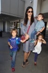 Camila Alves at the airport with kids Levi, Vida and Livingston McConaughey