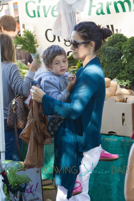 Carrie Anne Moss takes her daughter Frances Beatrice Roy to the Farmers Market in Pacific Palisades, Los Angeles