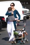 Carrie Ann Moss spends the day out shopping at the farmers market in Pacific Palisades with daughter Frances Beatrice Roy in Los Angeles