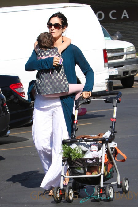 Carrie Ann Moss spends the day out shopping at the farmers market in Pacific Palisades with daughter Frances Beatrice Roy in Los Angeles