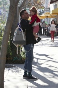 Cash Warren carries his daughter Haven