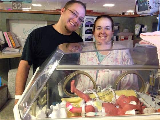 Chad Doss, pictured here with wife Amanda and one of their identical triplet girls