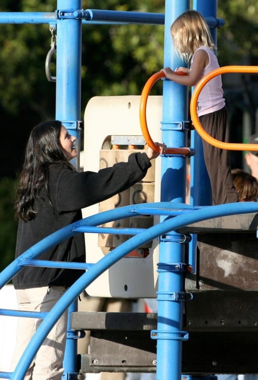 Courteney Cox plays with her daughter Coco during a break from filming on the set of her new movie "Bedtime Stories"