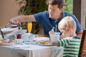Dad and son having breakfast