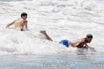 SURFS UP! David Beckham takes his sons Brooklyn, Romeo and Cruz to hit the surf and sand in Los Angeles