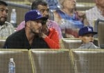 David Beckham watches the Los Angeles Dodgers play the Atlanta Braves with his boys