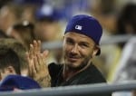 David Beckham watches the Los Angeles Dodgers play the Atlanta Braves with his boys