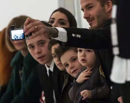 David Beckham with his family front row at NYFW14