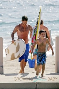 SURFS UP! David Beckham takes his sons Brooklyn, Romeo and Cruz to hit the surf and sand in Los Angeles