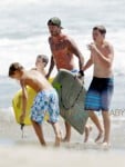 SURFS UP! David Beckham takes his sons Brooklyn, Romeo and Cruz to hit the surf and sand in Los Angeles