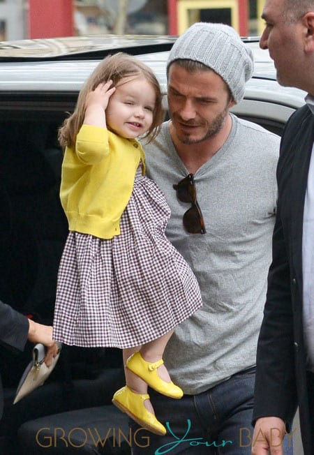 David & Victoria Beckham Take Harper Along While Shopping In Paris